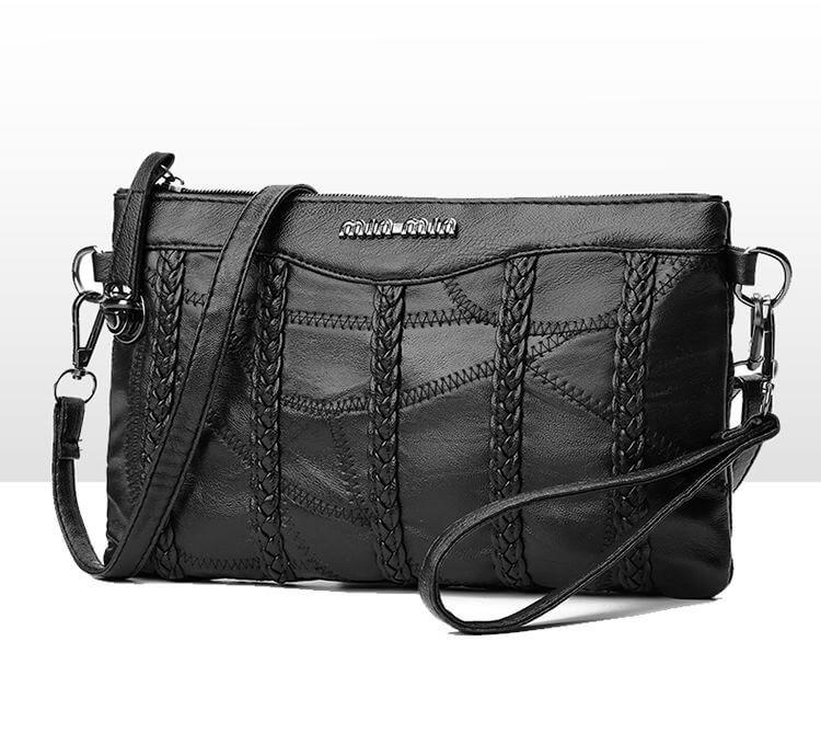"Elegant crossbody clutch väska i svart PU-läder för kvinnor, med modern design och plats för nödvändigheter."