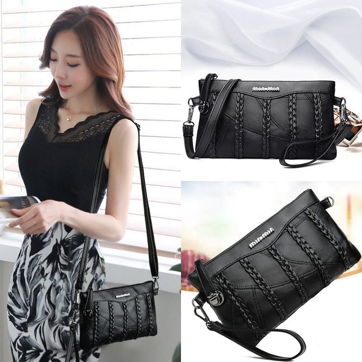 "Elegant crossbody clutch väska i svart PU-läder för kvinnor, med modern design och plats för nödvändigheter."