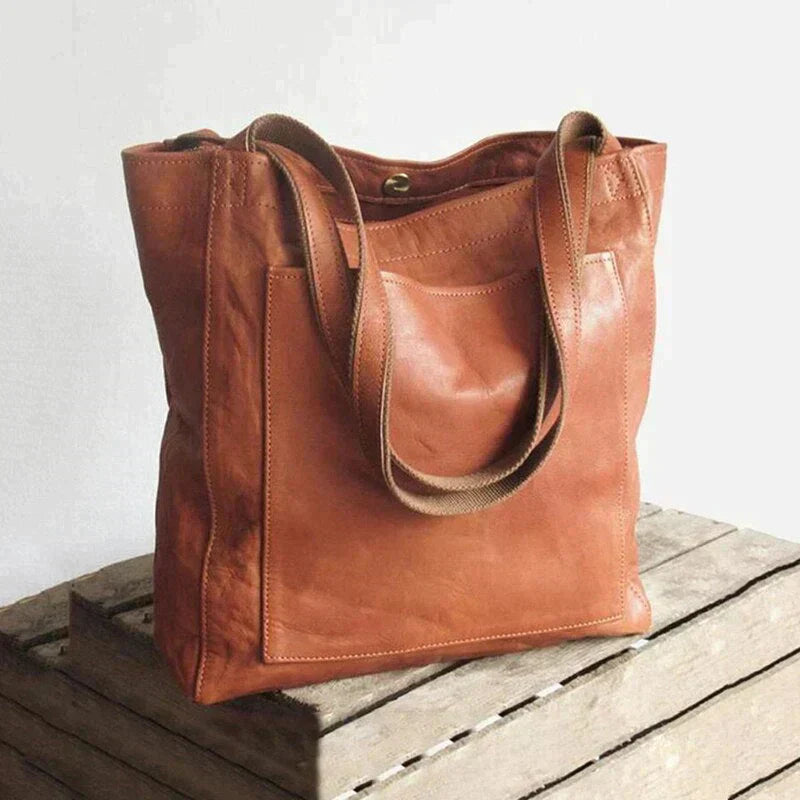 "Elegant dam handväska i brun och svart PU-läder, perfekt för modern stil och funktion, med tidlös och mångsidig design."