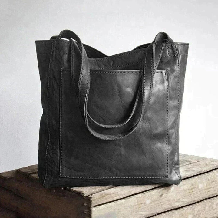 "Elegant dam handväska i brun och svart PU-läder, perfekt för modern stil och funktion, med tidlös och mångsidig design."