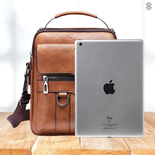 "Elegant dam laptopväska i PU-läder med justerbar axelrem, flera fack, perfekt för både arbete och fritid."