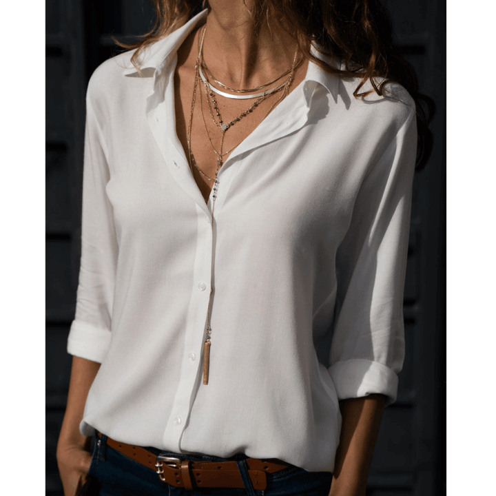 "Elegant dam långärmad blus i polyester, blå färg, med detaljerat snitt och lätt material, perfekt för alla tillfällen."