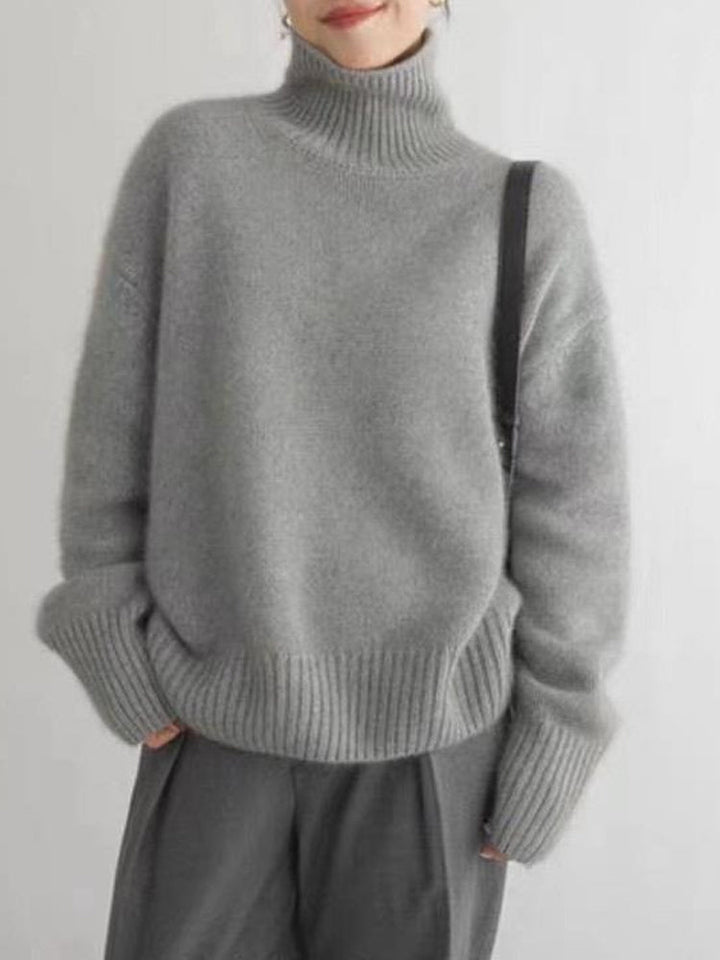 "Elegant dam rollkragenpullover i mjuk kaschmir, idealisk för höst och vinter, erbjuder både stil och värme i flera färger."