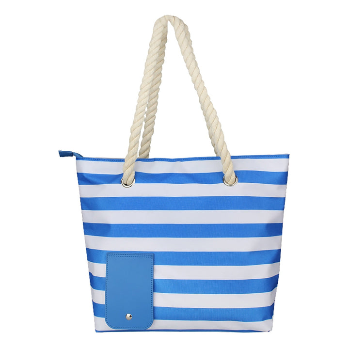 "Elegant dam strandväska i beige canvas med dold vinfunktion och sidofickor, perfekt för sommarutflykter."