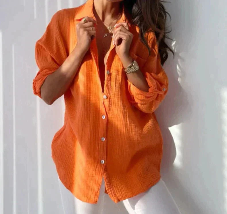 "Elegant damblus i andningsbart tyg, färgrik palett i orange, rosa, turkos och grå för sommar och vår."