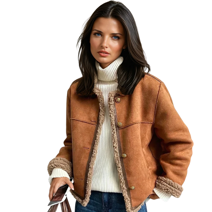 "Elegant damens shearling jacka med knäppning, varm och stilfull för vinterdagar, med sidofickor och detaljrik design."