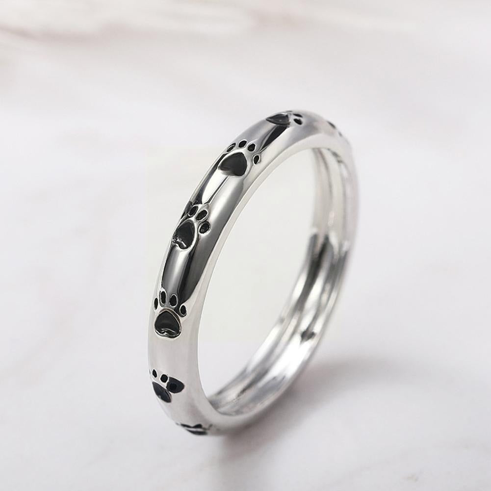 "Elegant damer hundtassring i glänsande zinklegering med gnistrande zirkon, symboliserar kärlek till husdjur."
