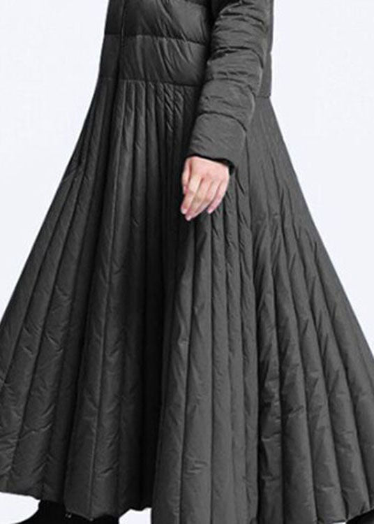 "Elegant damernas vinterkappa med rundad design och fickor, perfekt för värme och stil under kyliga dagar."