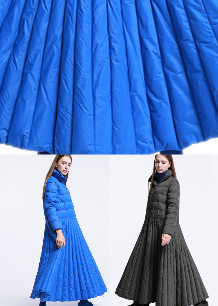 "Elegant damernas vinterkappa med rundad design och fickor, perfekt för värme och stil under kyliga dagar."