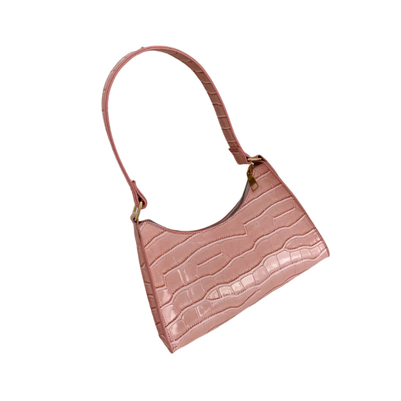 "Elegant damhandväska i konstläder, beige, med rymlig design och stilren look, perfekt för vardag och evenemang."