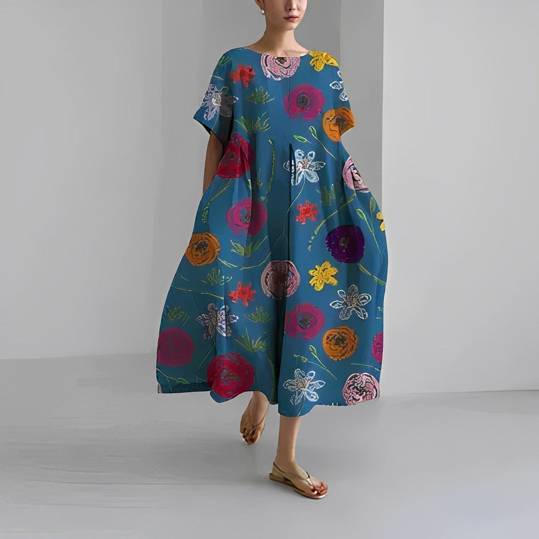 "Elegant damklänning i mjuk bomull med blommönster, figurnära passform och somrig stil, perfekt för varma dagar."