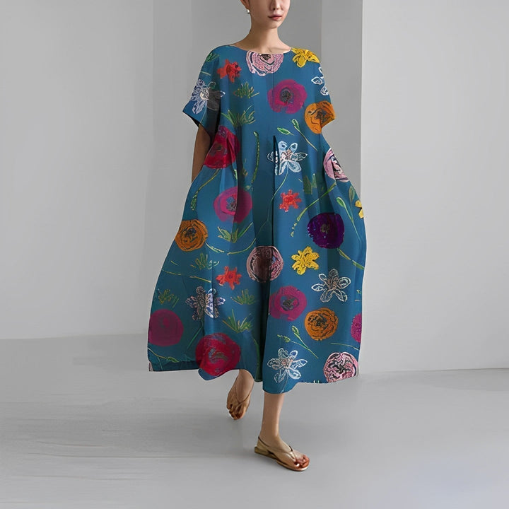 "Elegant damklänning i mjuk bomull med blommönster, figurnära passform och somrig stil, perfekt för varma dagar."