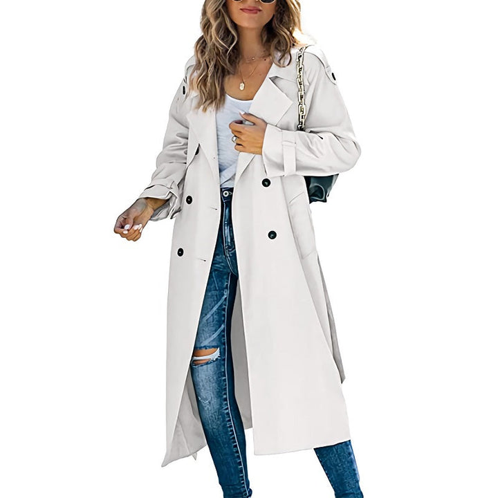 Elegant dubbelknäppt trenchcoat för kvinnor, lång och stilren design, perfekt för alla tillfällen.