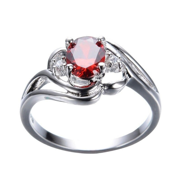 "Elegant födelsesten ring med oval sten & cubic zirconia, perfekt för kvinnor, vardag & festliga tillfällen, i blå och röd."
