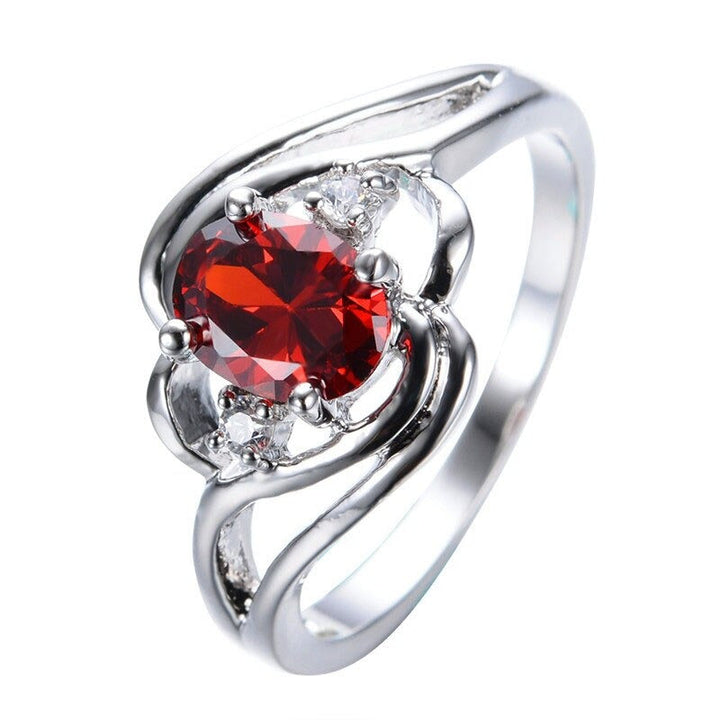 "Elegant födelsesten ring med oval sten & cubic zirconia, perfekt för kvinnor, vardag & festliga tillfällen, i blå och röd."