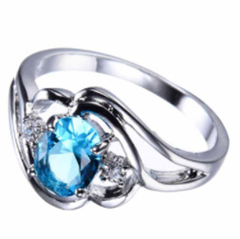 "Elegant födelsesten ring med oval sten & cubic zirconia, perfekt för kvinnor, vardag & festliga tillfällen, i blå och röd."