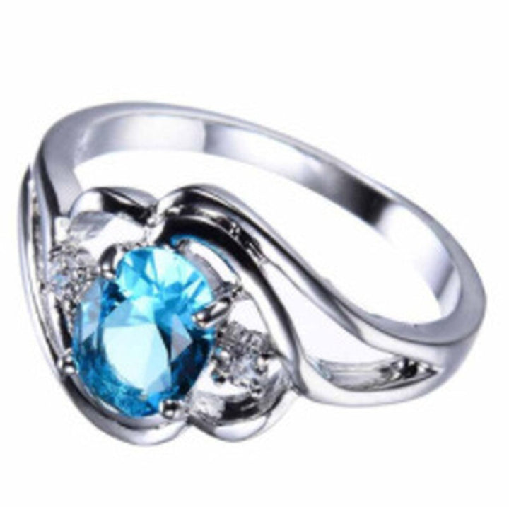 "Elegant födelsesten ring med oval sten & cubic zirconia, perfekt för kvinnor, vardag & festliga tillfällen, i blå och röd."
