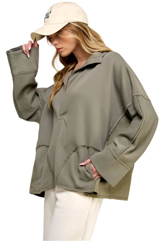 "Elegant grön dam V-neck dolman pullover med mjukt material och modern design, perfekt för avslappnad eller festlig stil."