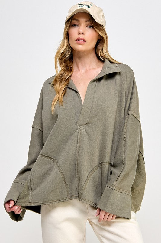 "Elegant grön dam V-neck dolman pullover med mjukt material och modern design, perfekt för avslappnad eller festlig stil."