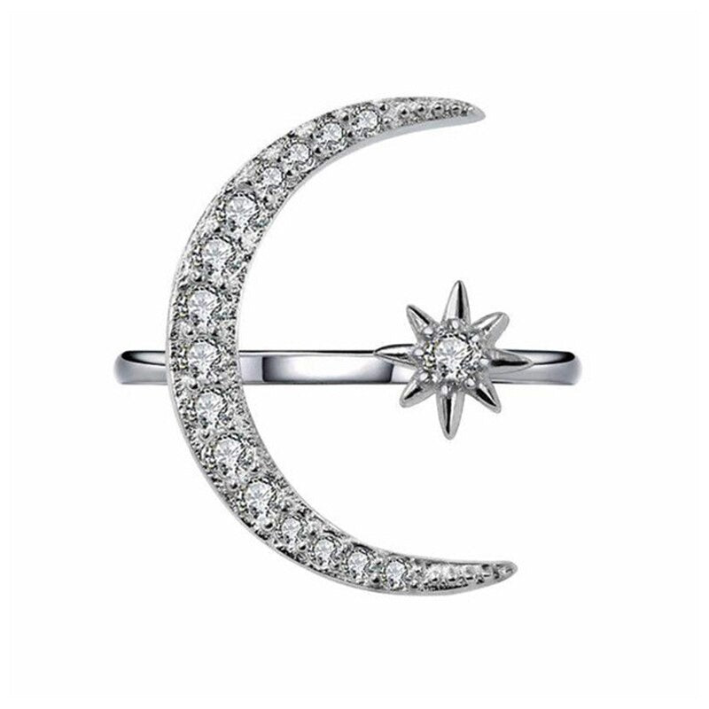 "Elegant justerbar halvmåne- och stjärndesignring i glänsande silver, perfekt för kvinnor som söker stil och variation."