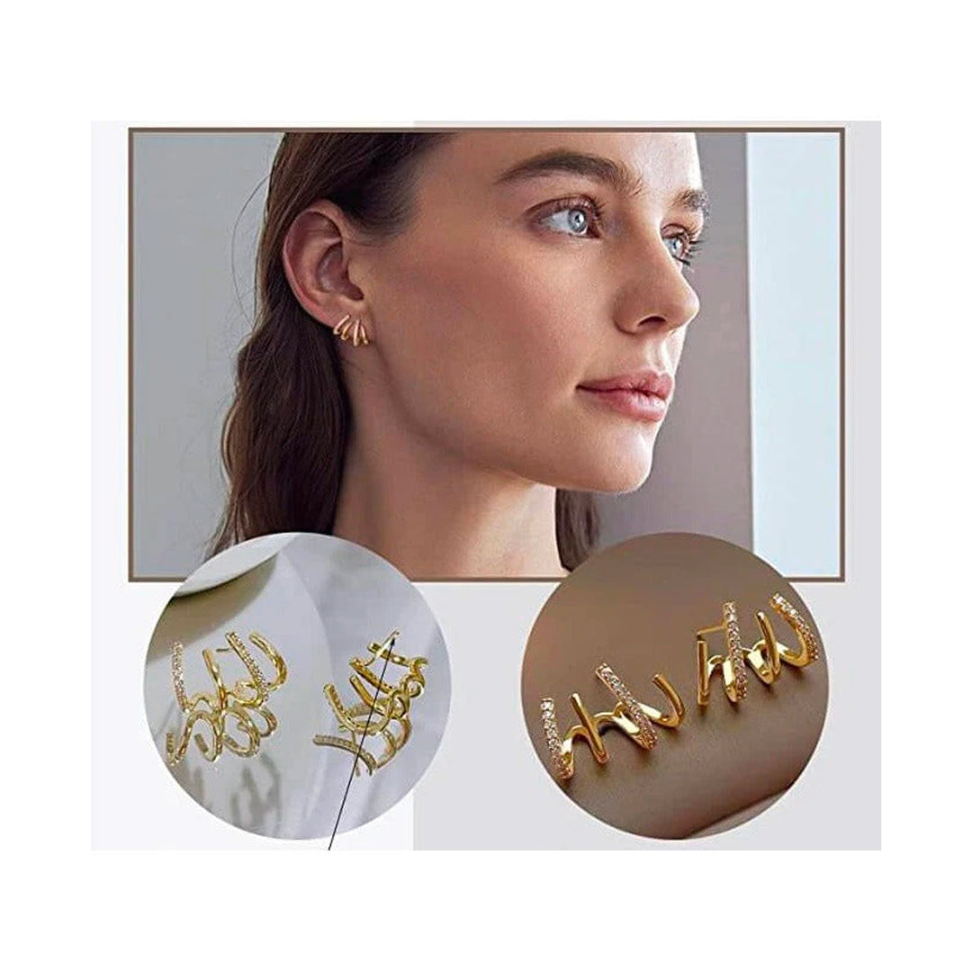"Elegant klor örhängen med kubisk zirkonia, guldfärg, feminin design, ger illusion av flera piercingar, kvinnor."