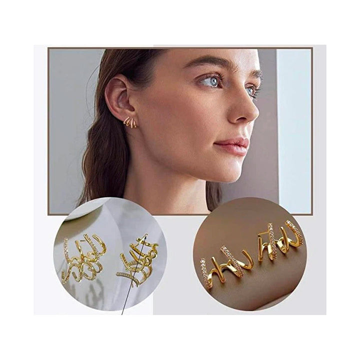 "Elegant klor örhängen med kubisk zirkonia, guldfärg, feminin design, ger illusion av flera piercingar, kvinnor."