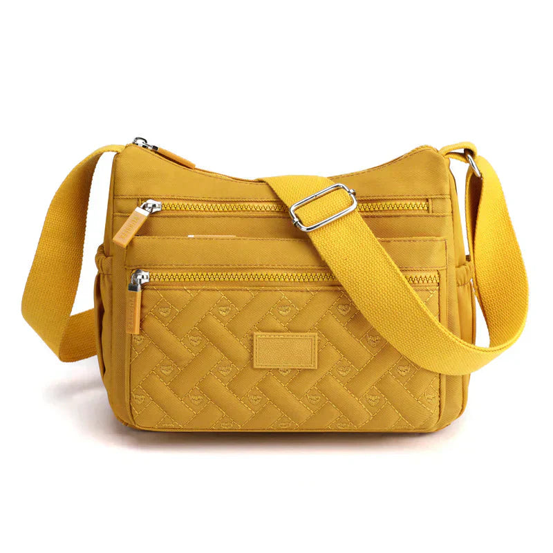 Elegant kvinnors axelväska, crossbody med justerbar rem, flera fack och tidlös design i olika färger, perfekt för vardagen.