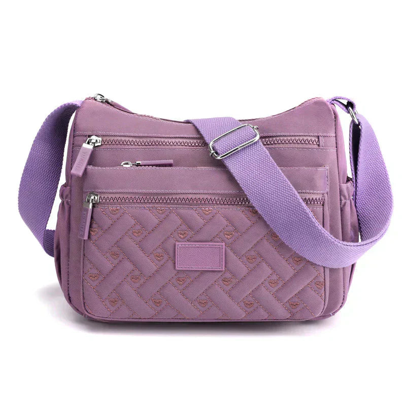 Elegant kvinnors axelväska, crossbody med justerbar rem, flera fack och tidlös design i olika färger, perfekt för vardagen.
