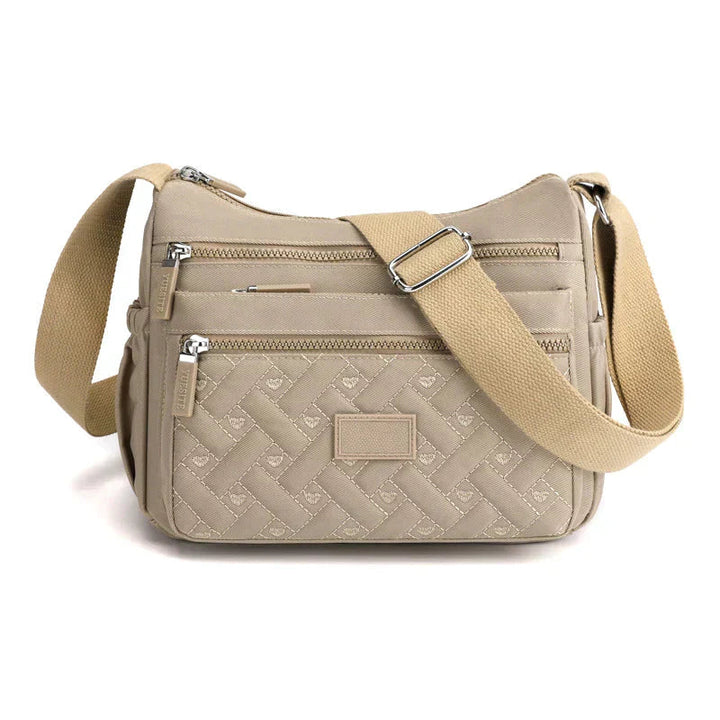 Elegant kvinnors axelväska, crossbody med justerbar rem, flera fack och tidlös design i olika färger, perfekt för vardagen.
