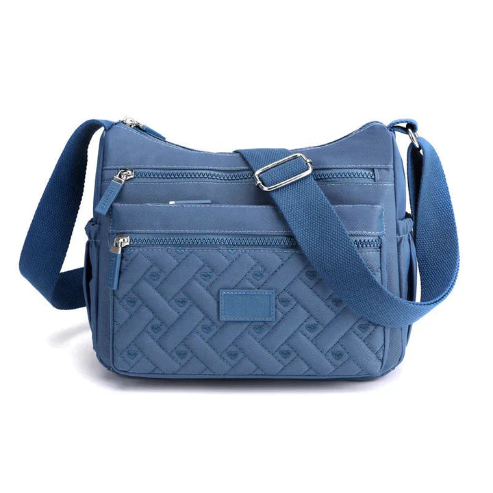 Elegant kvinnors axelväska, crossbody med justerbar rem, flera fack och tidlös design i olika färger, perfekt för vardagen.