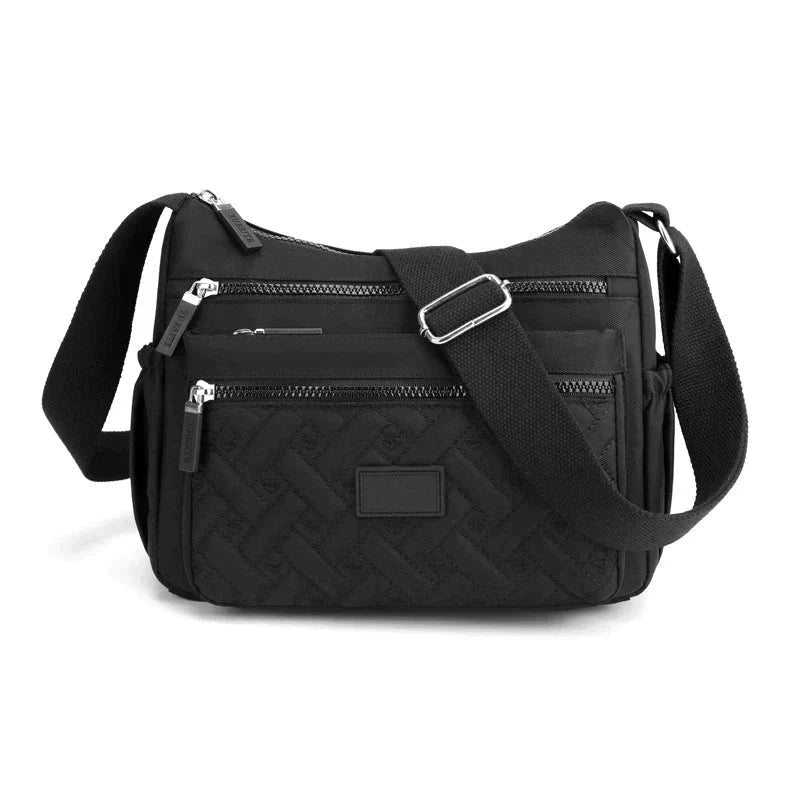 Elegant kvinnors axelväska, crossbody med justerbar rem, flera fack och tidlös design i olika färger, perfekt för vardagen.