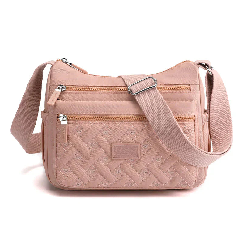 Elegant kvinnors axelväska, crossbody med justerbar rem, flera fack och tidlös design i olika färger, perfekt för vardagen.