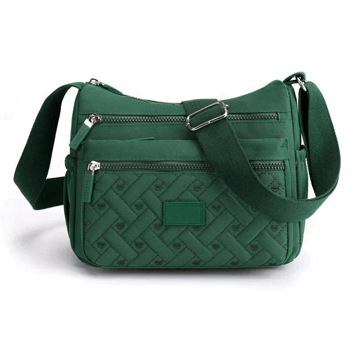 Elegant kvinnors axelväska, crossbody med justerbar rem, flera fack och tidlös design i olika färger, perfekt för vardagen.