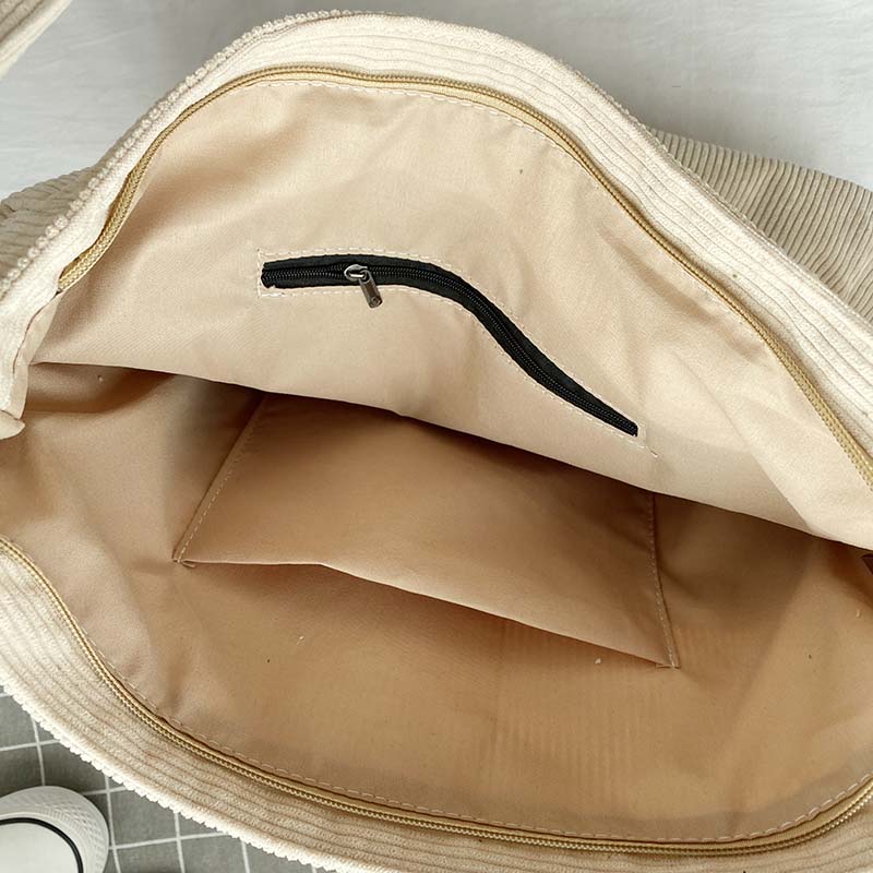 Elegant kvinnors axelväska i textil, justerbar rem, flera fickor, finns i beige, brun, grå, grön, svart.