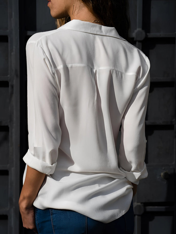 "Elegant långärmad damblus i orange polyester, V-neck och avslappnad passform, idealisk för alla tillfällen."