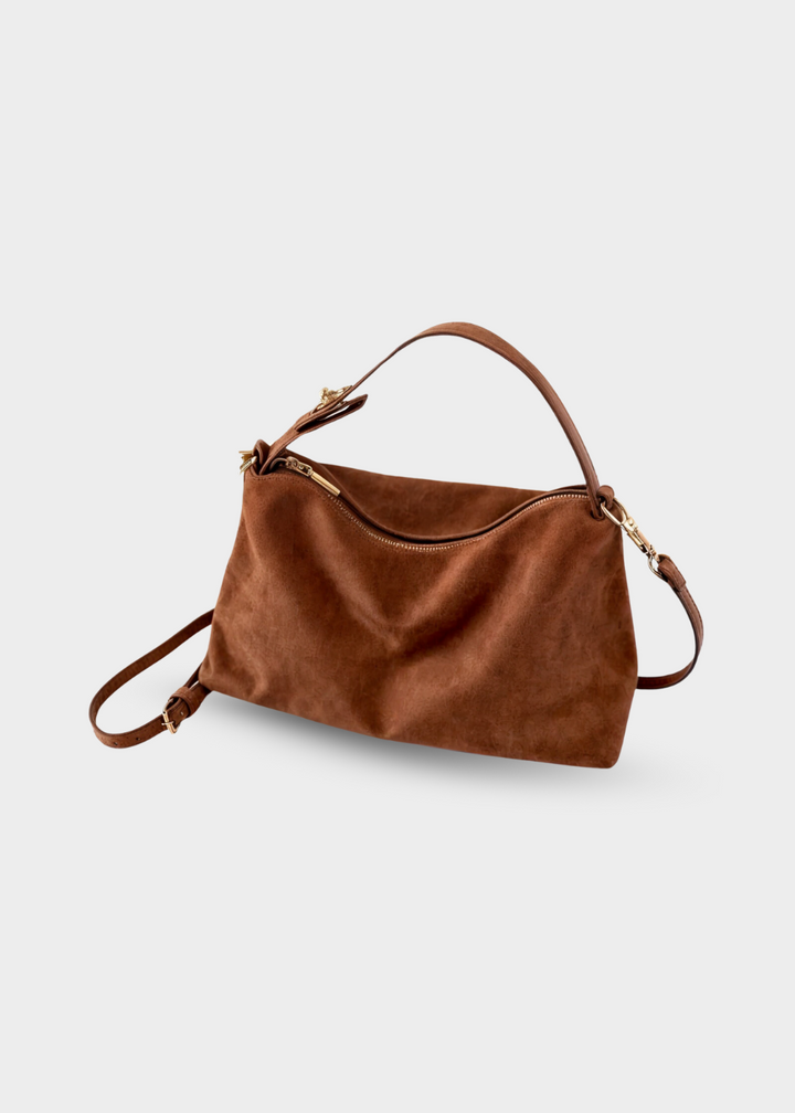 "Elegant rymlig damväska i konstmocka med texturerad yta och neutral design, perfekt för vardag och kväll."