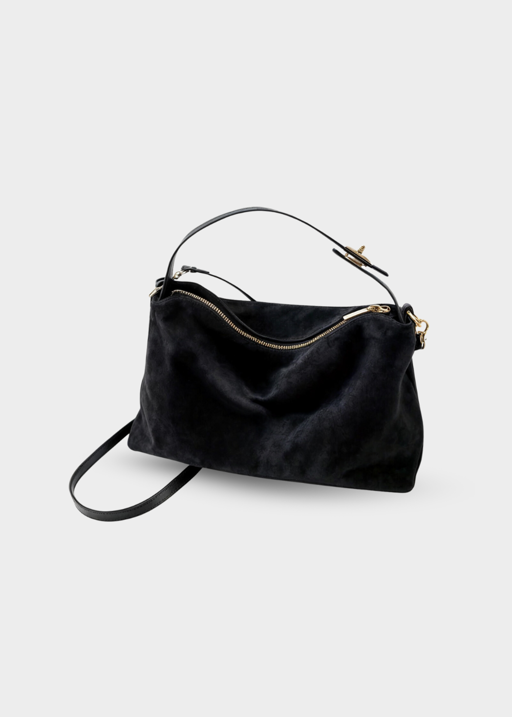 "Elegant rymlig damväska i konstmocka med texturerad yta och neutral design, perfekt för vardag och kväll."