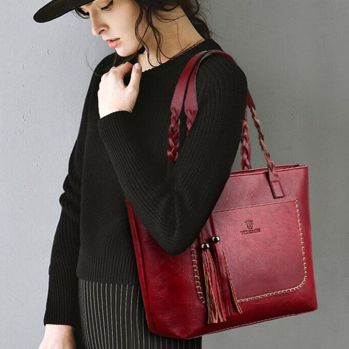 "Elegant skulderväska i PU-läder för kvinnor, flätade handtag, rymlig design, sofistikerad accessoar för varje tillfälle."