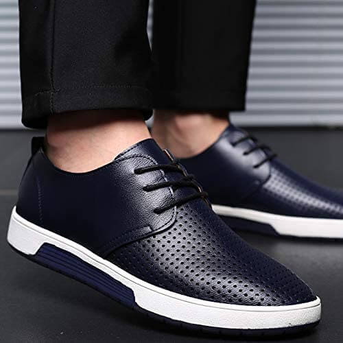 "Eleganta Oxford herrskor i svart PU-läder med perforerad yta och flexibel gummisula, erbjuder stil och komfort."