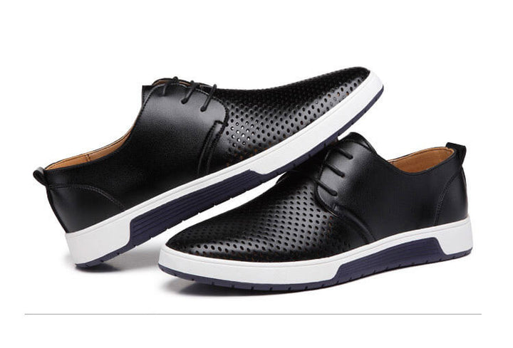"Eleganta Oxford herrskor i svart PU-läder med perforerad yta och flexibel gummisula, erbjuder stil och komfort."