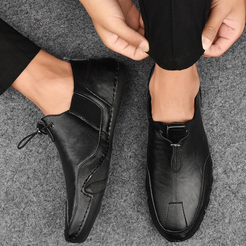 "Eleganta herr loafers i svart PU-läder, slip-on design, stilren silhuett, perfekt för både avslappnade och formella stilar."