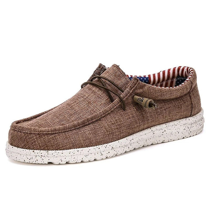 "Eleganta herrloafers med snörning och halkfri sula; mjukt bomullstyg för daglig komfort och stil."