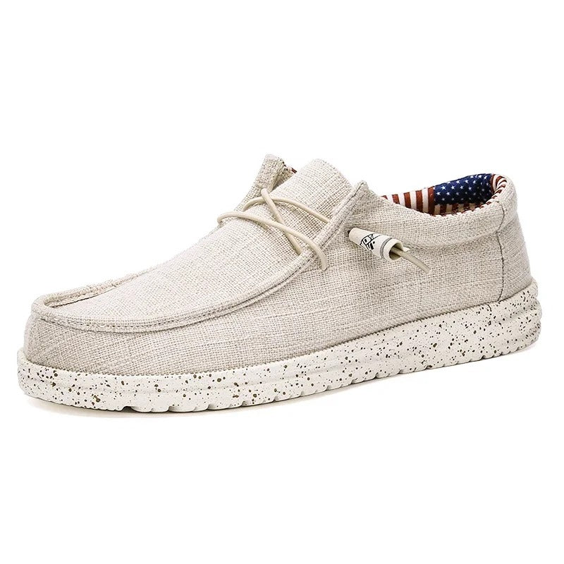 "Eleganta herrloafers med snörning och halkfri sula; mjukt bomullstyg för daglig komfort och stil."