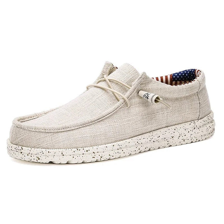 "Eleganta herrloafers med snörning och halkfri sula; mjukt bomullstyg för daglig komfort och stil."