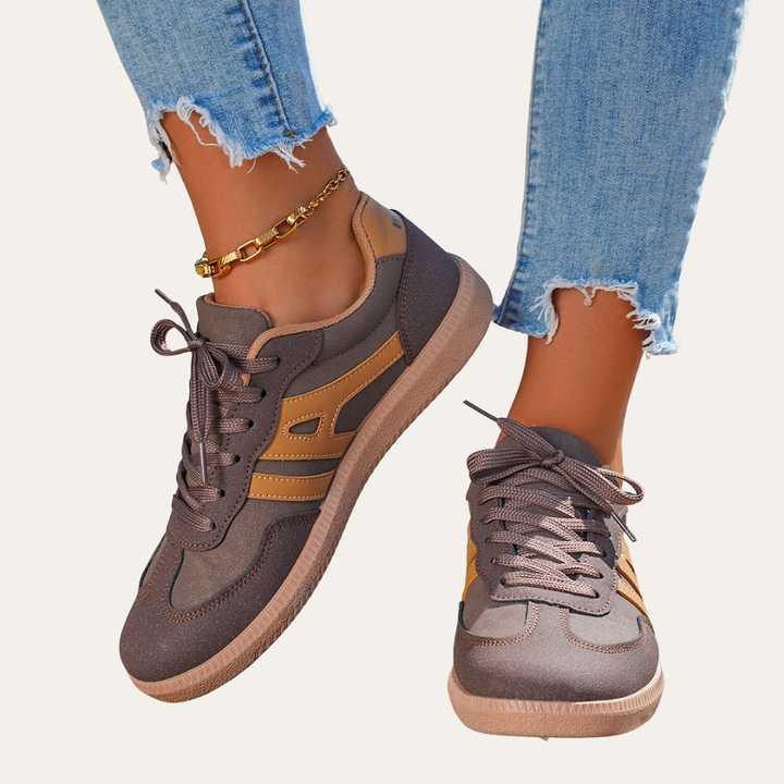 Eleganta kvinnors sneakers med fotvalvsstöd, komfortsula och hållbart läder för stil och vardagskomfort.