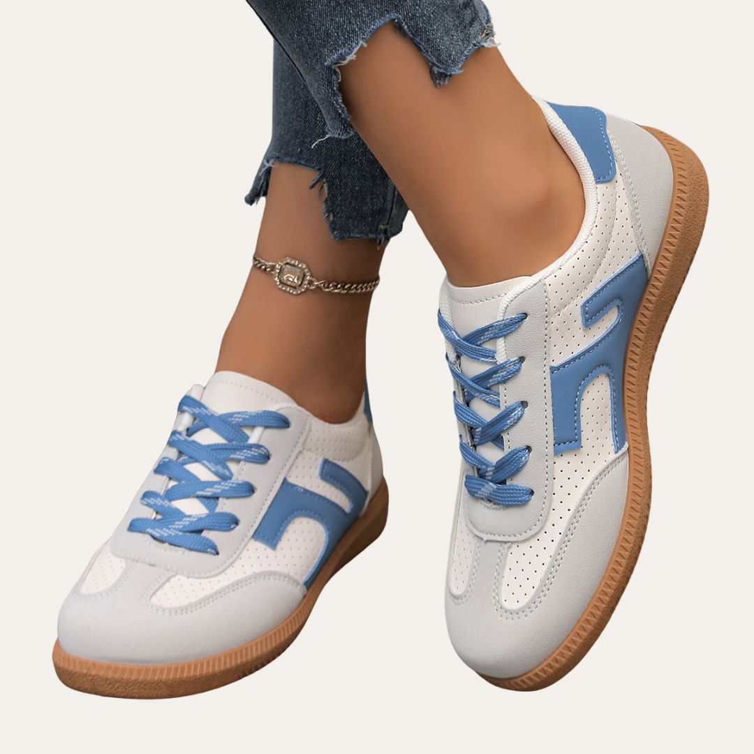 Eleganta kvinnors sneakers med fotvalvsstöd, komfortsula och hållbart läder för stil och vardagskomfort.