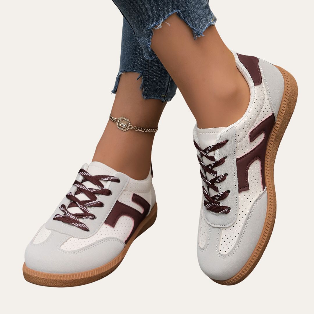 Eleganta kvinnors sneakers med fotvalvsstöd, komfortsula och hållbart läder för stil och vardagskomfort.