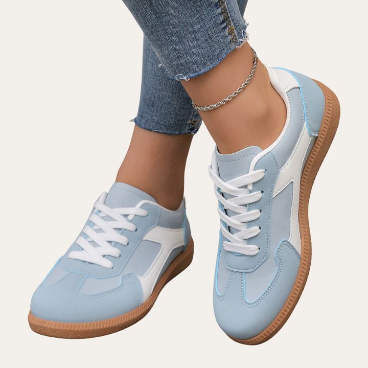 Eleganta kvinnors sneakers med fotvalvsstöd, komfortsula och hållbart läder för stil och vardagskomfort.