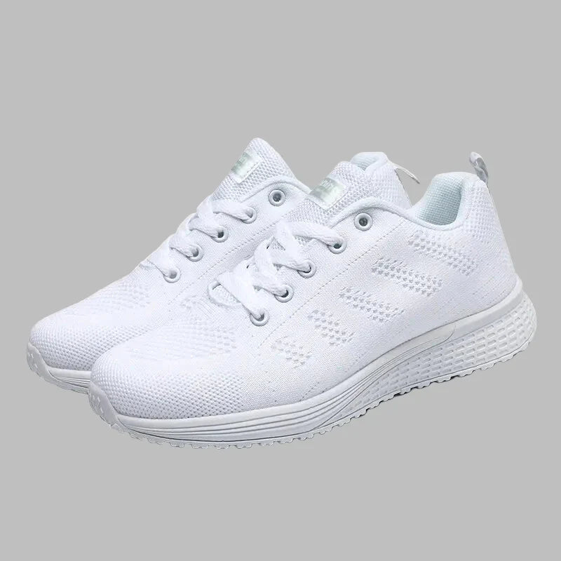 "Eleganta vita kvinnors sneakers med ventilerande mesh för stil och komfort året runt."