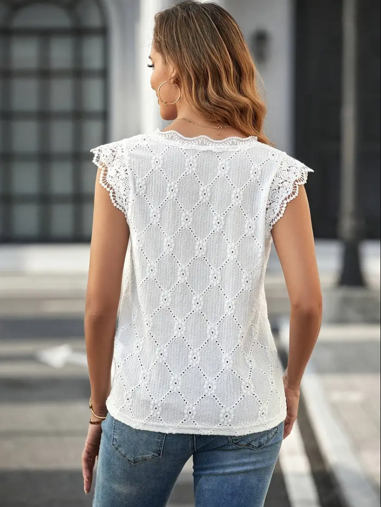 "Festlig dam V-ringad top med broderi, lätt tyg i ljus färg, perfekt för vår och sommar, elegant och feminin design."